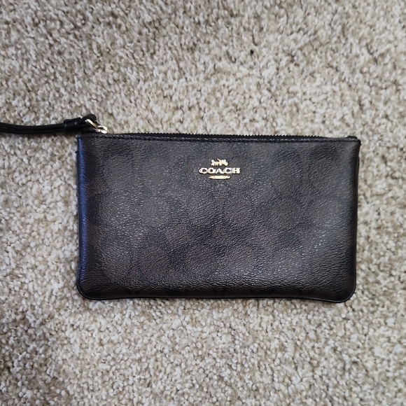 Coach Handbags - Coach Black Leather Wristlet with Gold Logo